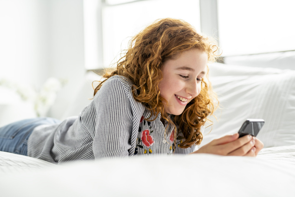 Kid using mobile phone